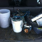 A picture showing copper wire in pails in the back of my car