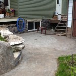 patio pavers in place and capstones waiting to be set and tooled to size