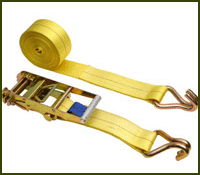 new yellow ratchet strap showing strap coiled up with steel hooked end and the ratchet end where strap is wound up in cylinder and hooked to an anchored object.